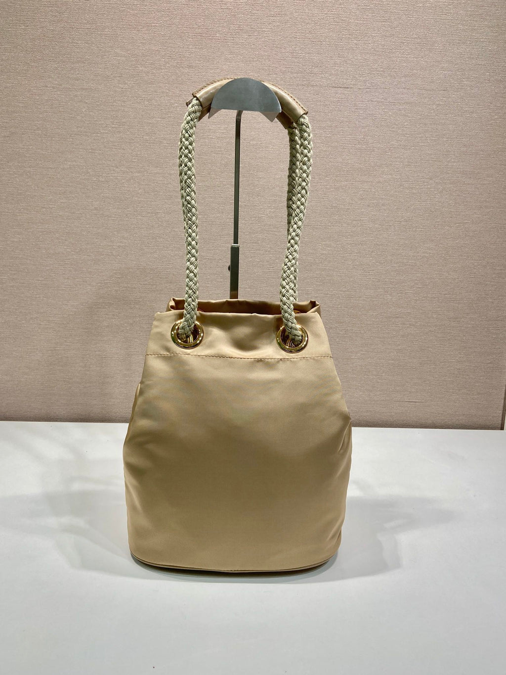 PRADA BUCKET BAG 28 IN BEIGE RE-NYLON GOLD LOGO