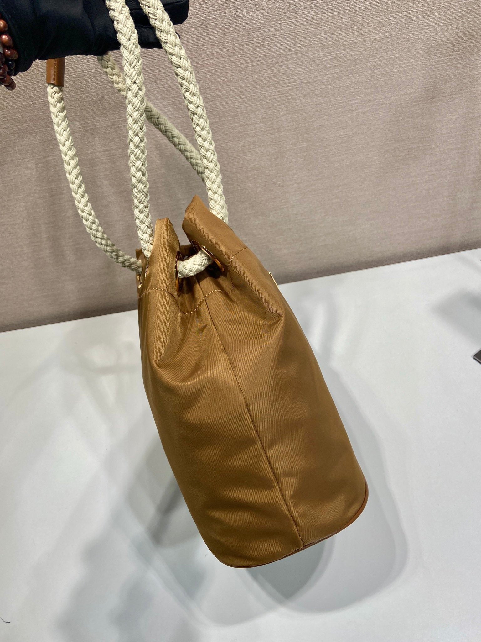 PRADA BUCKET BAG 28 IN SEPIA BROWN RE-NYLON GOLD LOGO