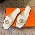 HERMES ILOT FLAT SANDAL IN WHITE CALFSKIN