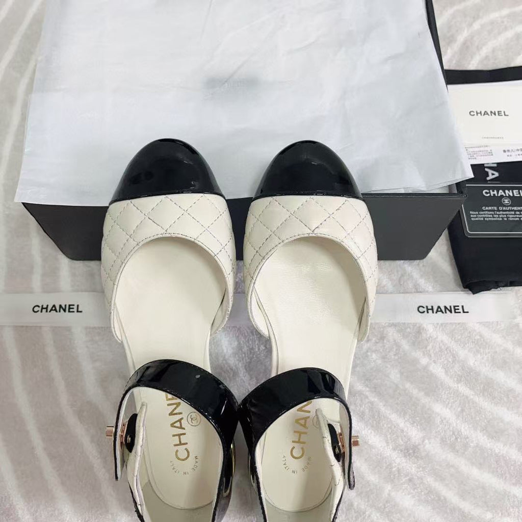 CHANEL CLASSIC MARY JANE FLATS IN WHITE AND BLACK QUILTED CALFSKIN
