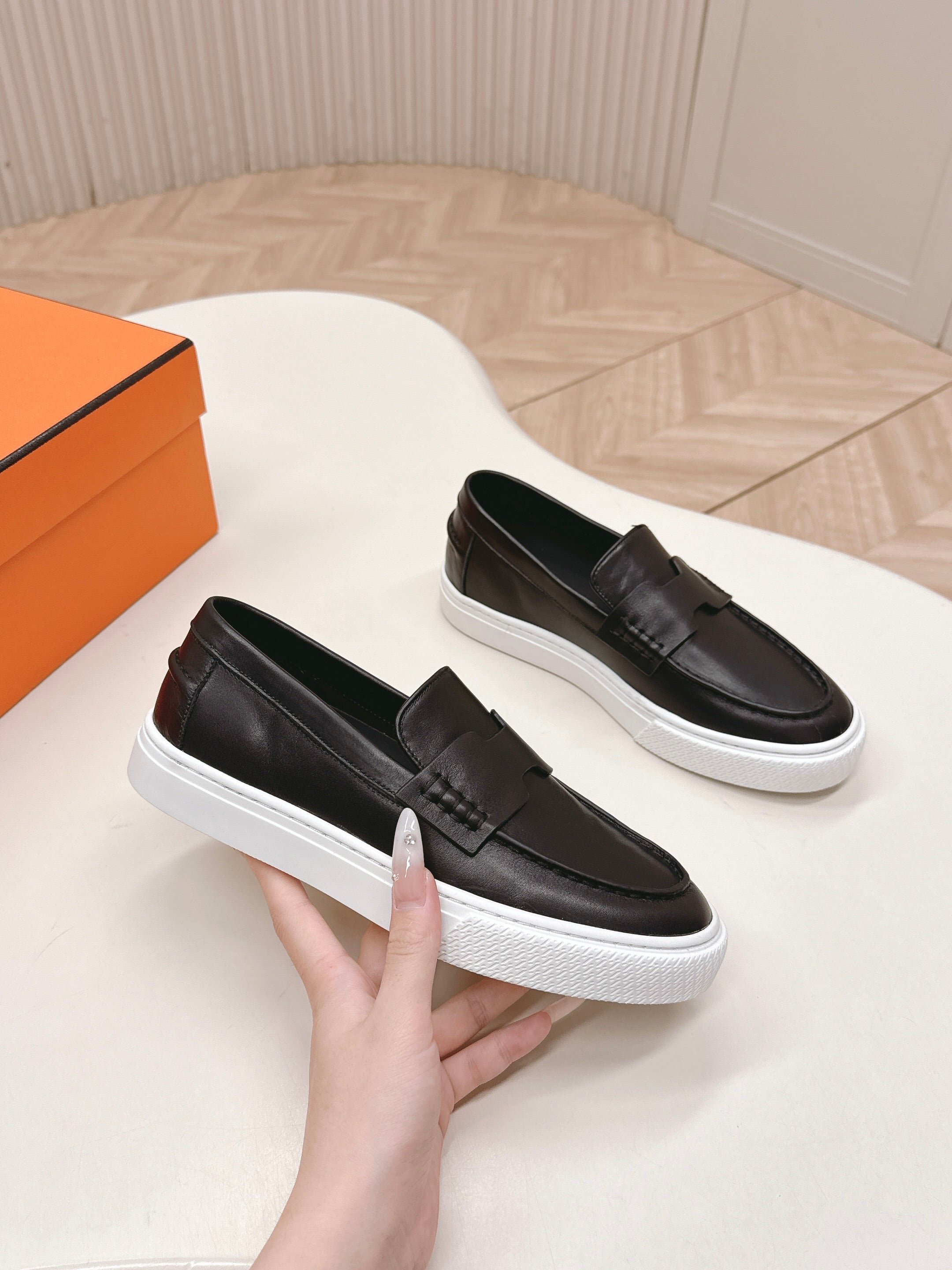 HERMES 25S SLIP-ON IN BLACK LAMBSKIN