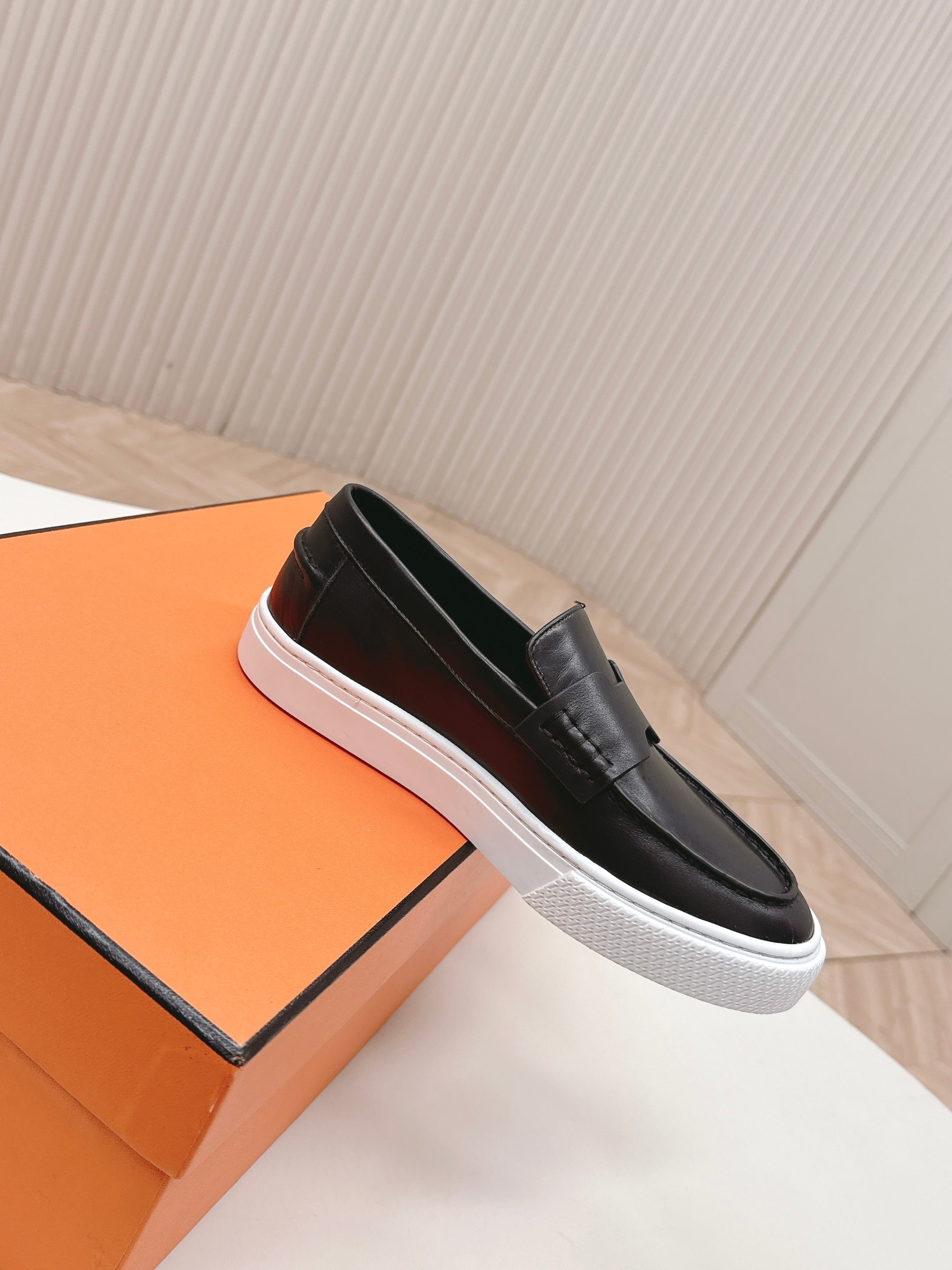 HERMES 25S SLIP-ON IN BLACK LAMBSKIN