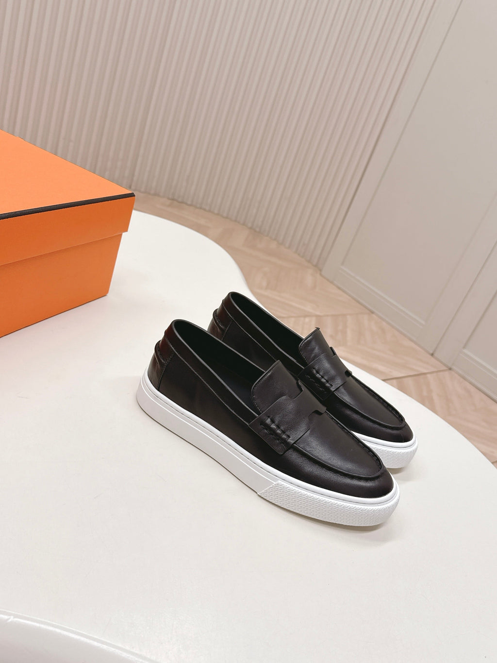 HERMES 25S SLIP-ON IN BLACK LAMBSKIN