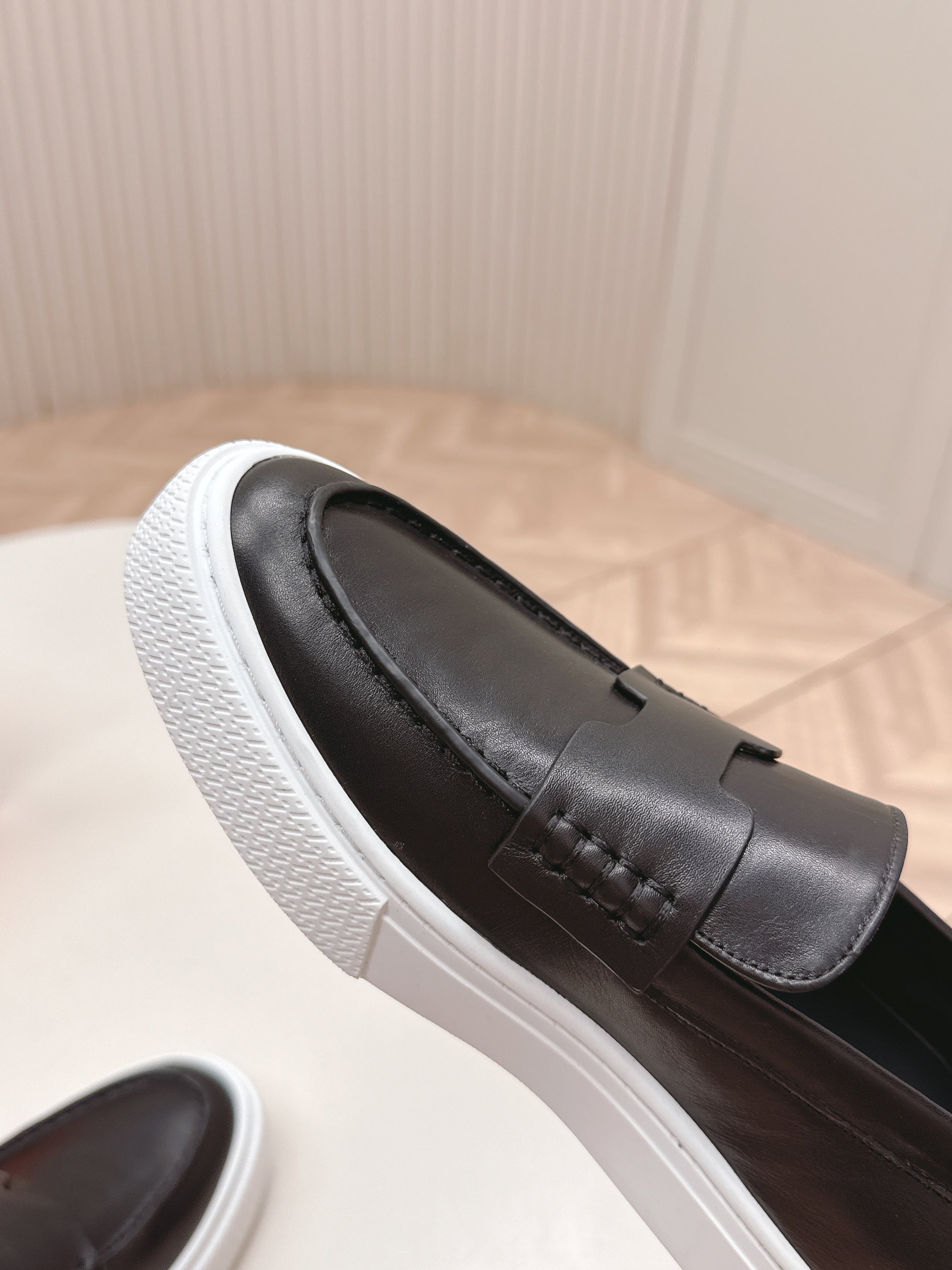 HERMES 25S SLIP-ON IN BLACK LAMBSKIN