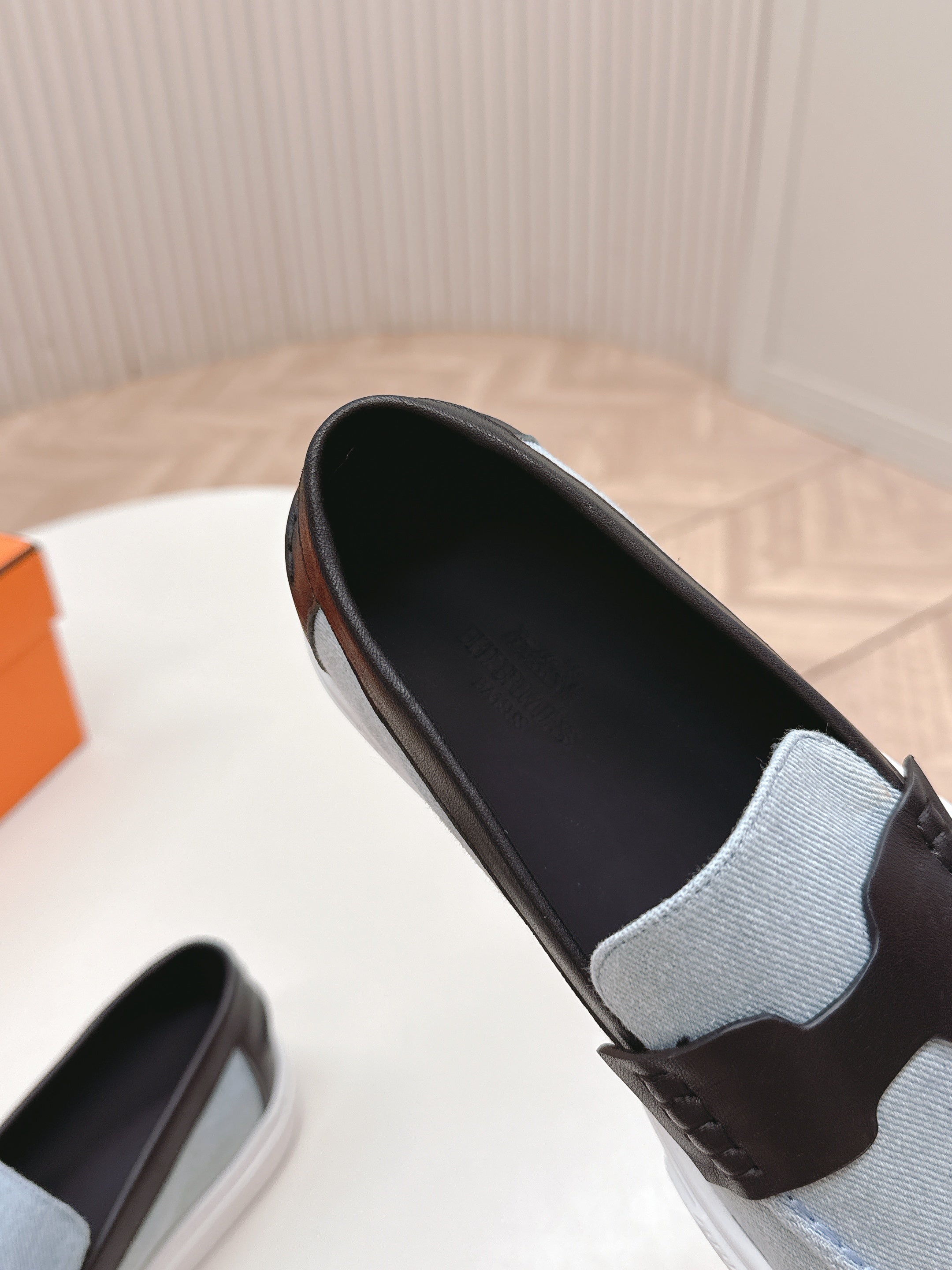 HERMES 25S SLIP-ON IN BLUE DENIM AND BLACK LAMBSKIN