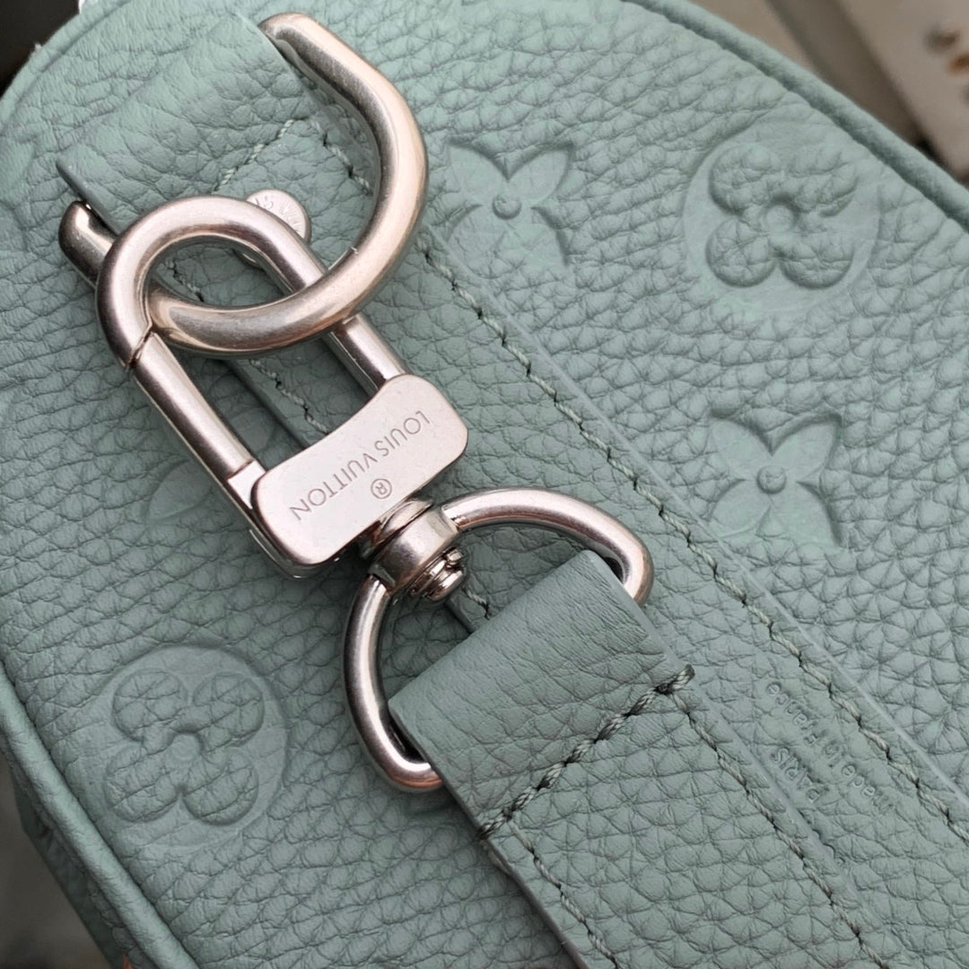 LOUIS VUITTON KEEPALL BANDOULIÈRE 25 BAG IN MISTY LAKE GREEN MONOGRAM TAURILLON CALFSKIN