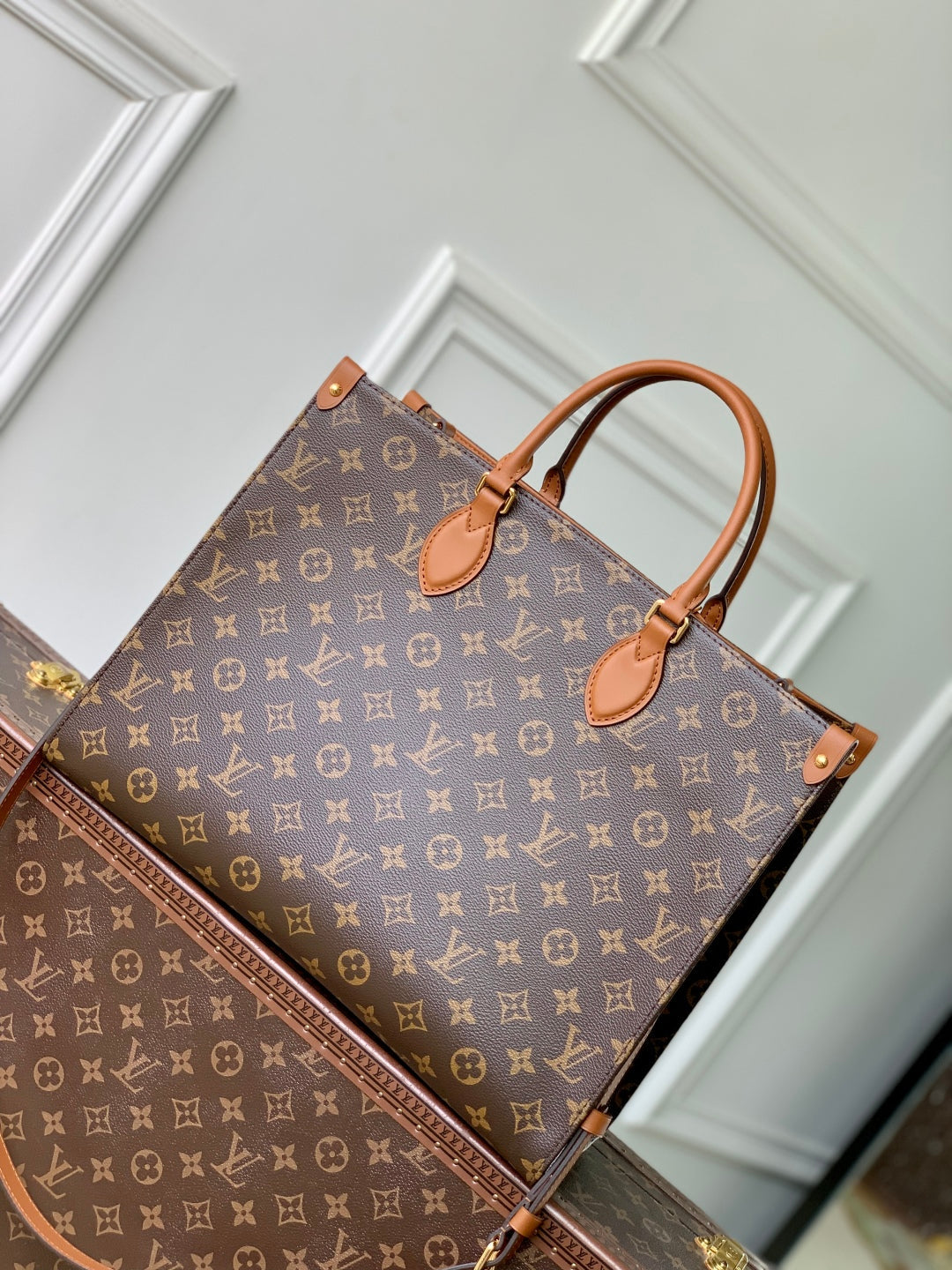 LOUIS VUITTON ONTHEGO ORGANIZER 37 IN BROWN COATED CANVAS AND CALFSKIN
