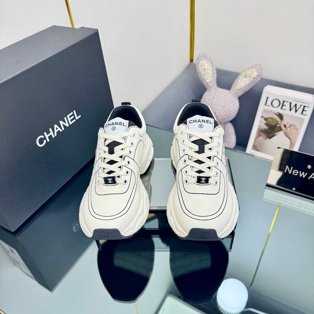 CHANEL TRAINERS SNEAKER IN WHITE CALFSKIN WITH BLACK EMBROIDERED