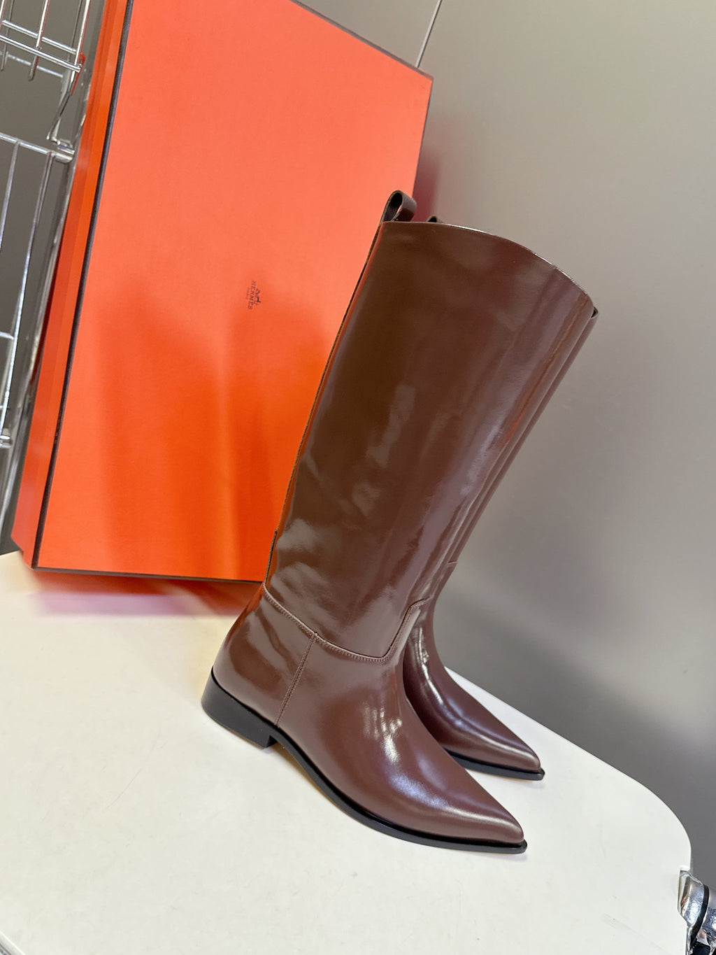 HERMES 25S POINTED-TOE KNEE-HIGH BOOTS IN BROWN GLOSSY LAMBSKIN