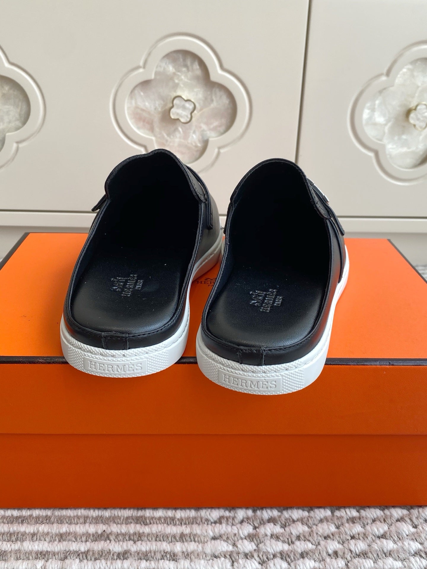 HERMES 25S MULES IN BLACK LAMBSKIN WITH SILVER HARDWARE