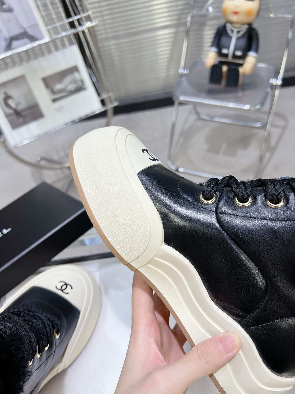 CHANEL MARTIN BOOTS IN BLACK CALFSKIN AND LAMB FUR LINING