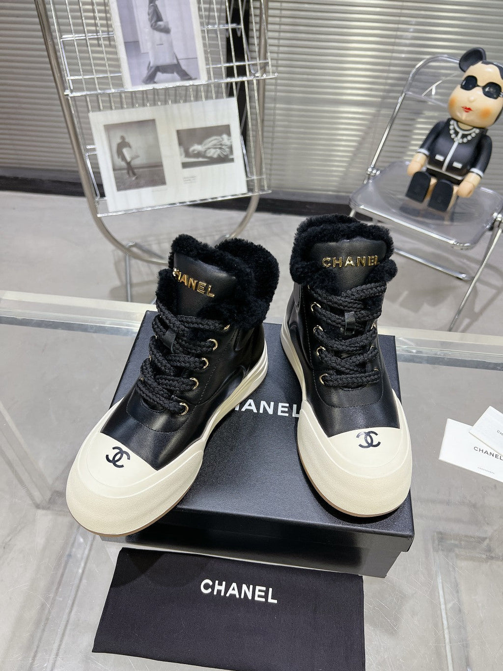 CHANEL MARTIN BOOTS IN BLACK CALFSKIN AND LAMB FUR LINING