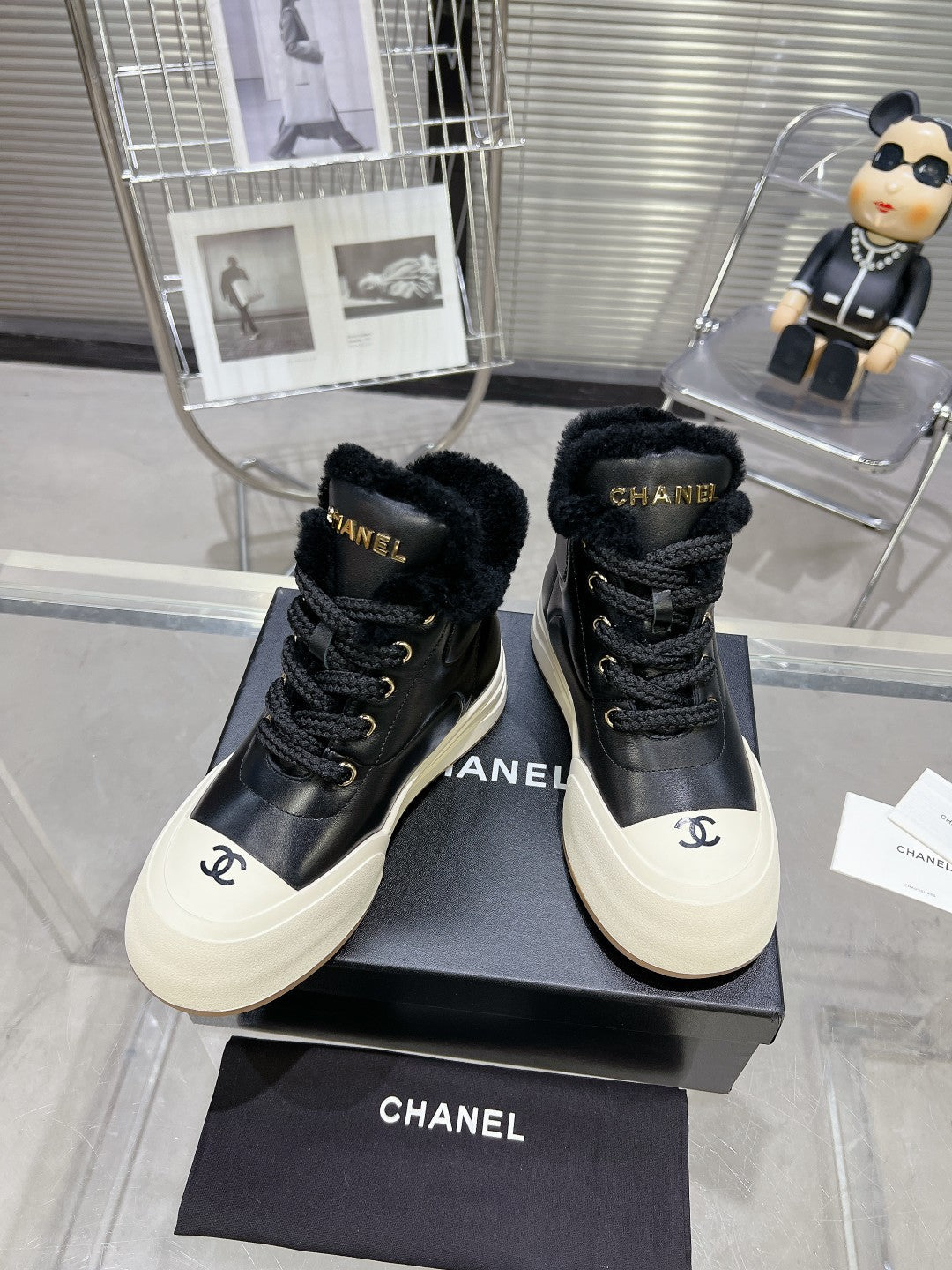 CHANEL MARTIN BOOTS IN BLACK CALFSKIN AND LAMB FUR LINING