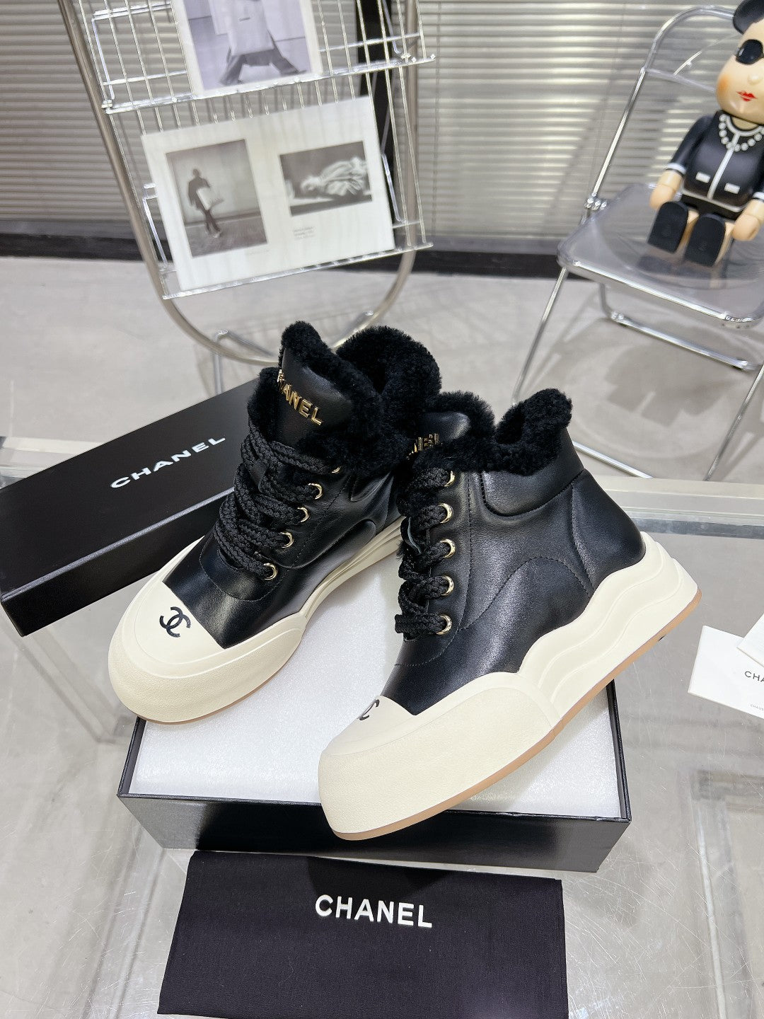 CHANEL MARTIN BOOTS IN BLACK CALFSKIN AND LAMB FUR LINING
