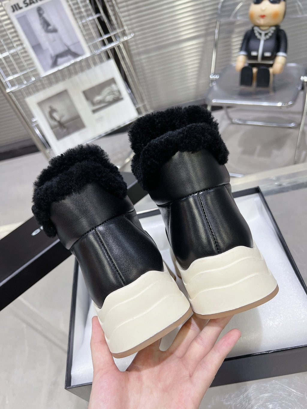 CHANEL MARTIN BOOTS IN BLACK CALFSKIN AND LAMB FUR LINING