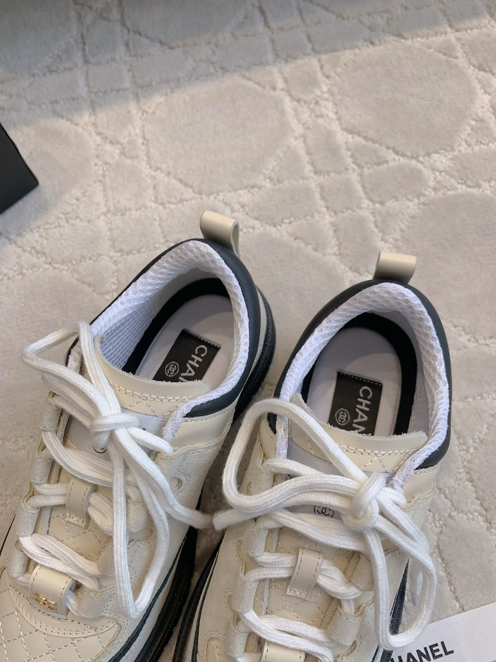 CHANEL 25S TRAINERS 40MM IN WHITE AND BLACK CALFSKIN