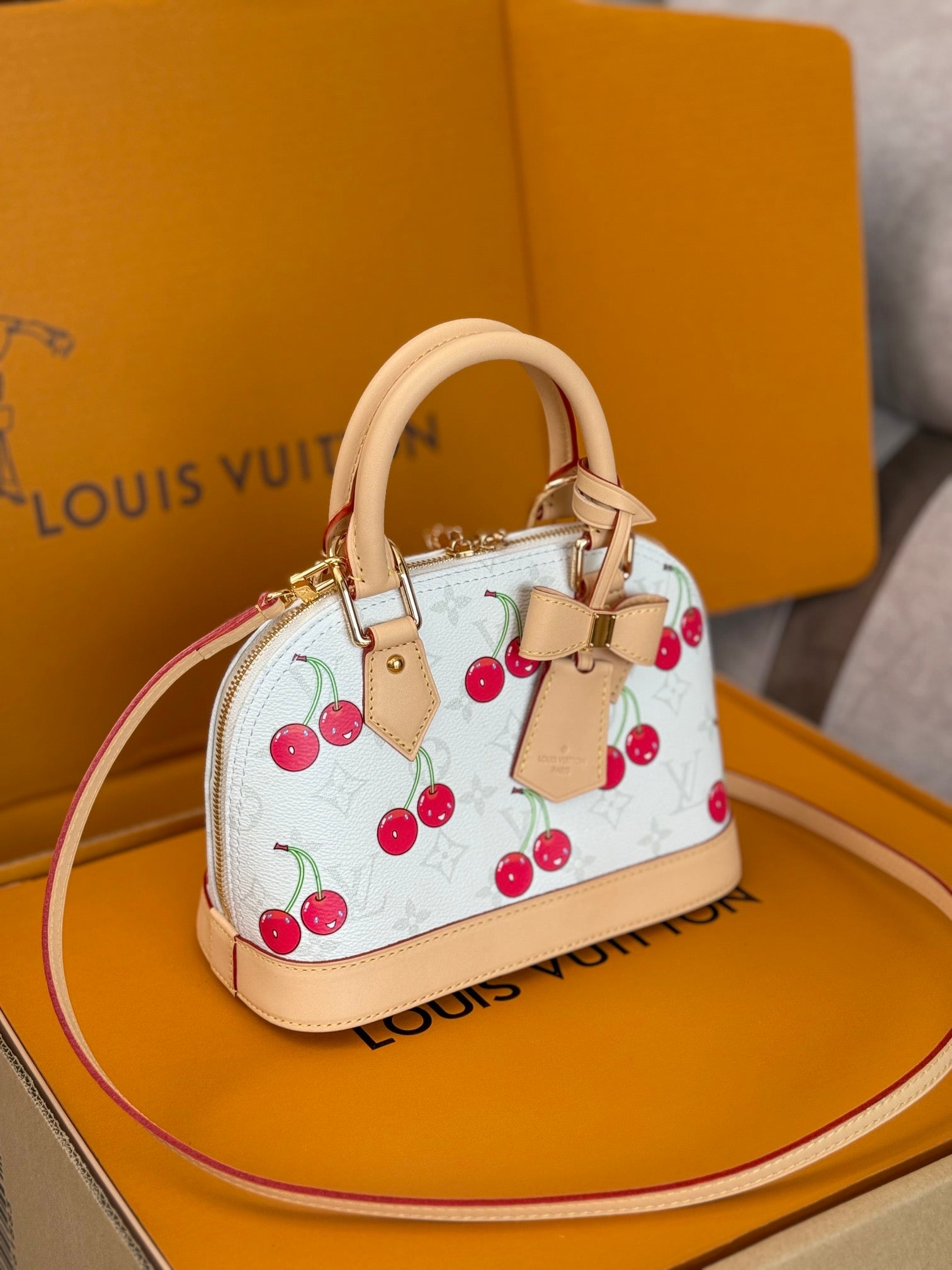 LOUIS VUITTON LV 25S ALMA BB 23 IN WHITE CANVAS MONOGRAM CHERRY PRINT GOLD HARDWARE