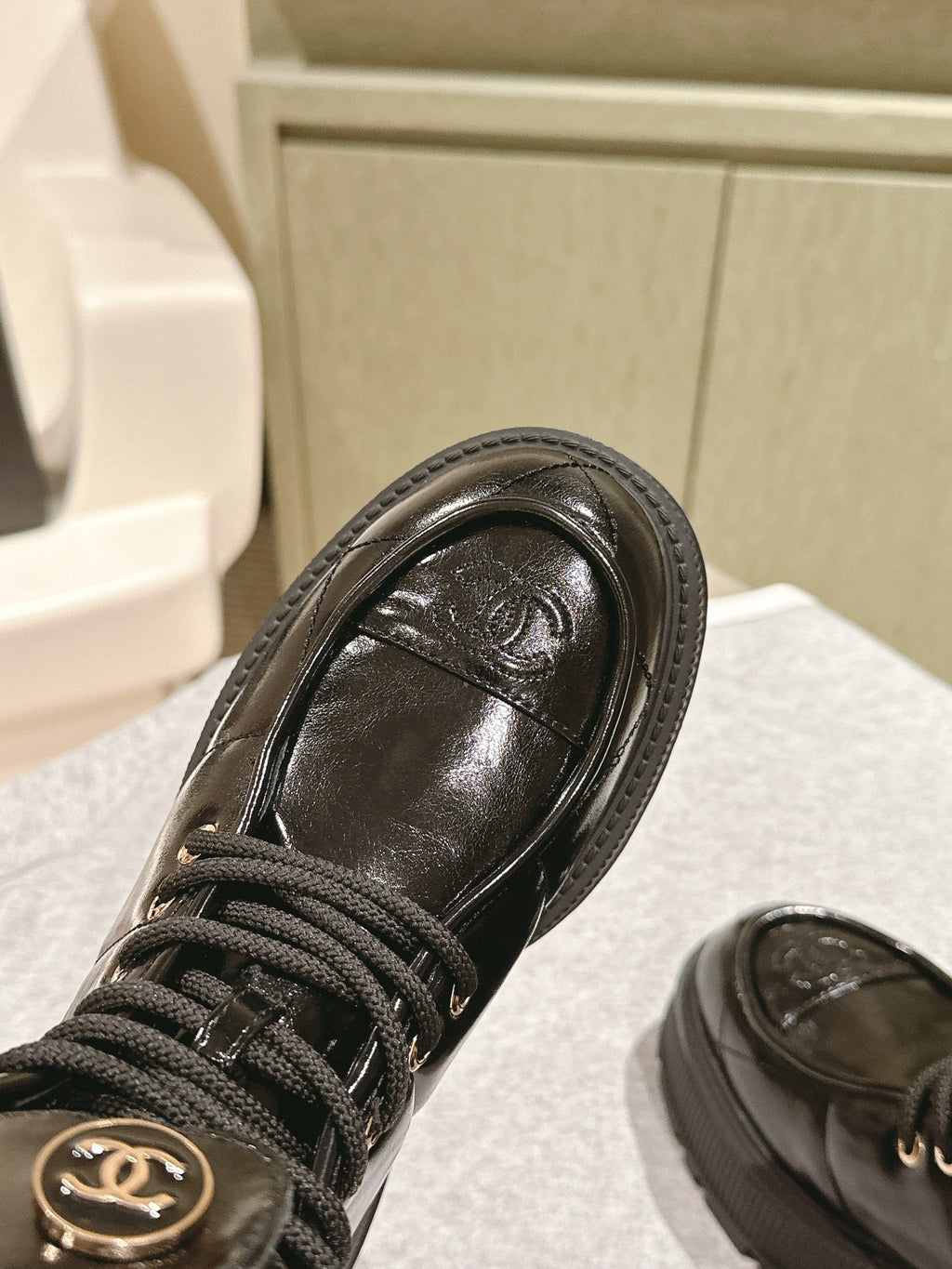 CHANEL MARTIN BOOTS IN BLACK EMBROIDERED CALFSKIN