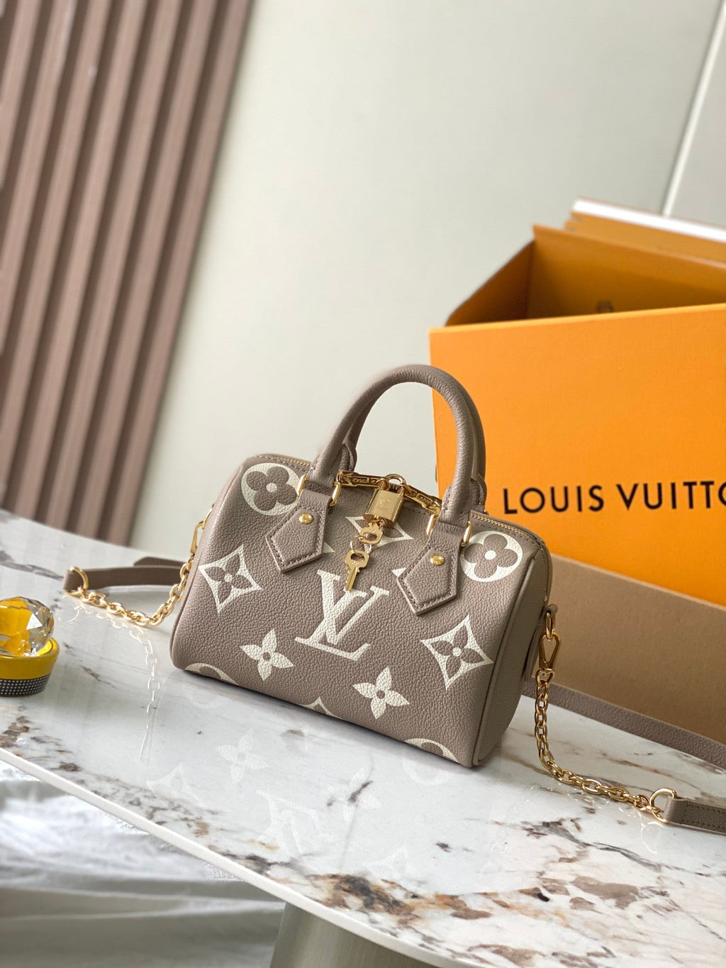 LOUIS VUITTON SPEEDY BANDOULIÈRE 20 IN TAUPE BROWN AND WHITE MONOGRAM EMPREINTE LEATHER