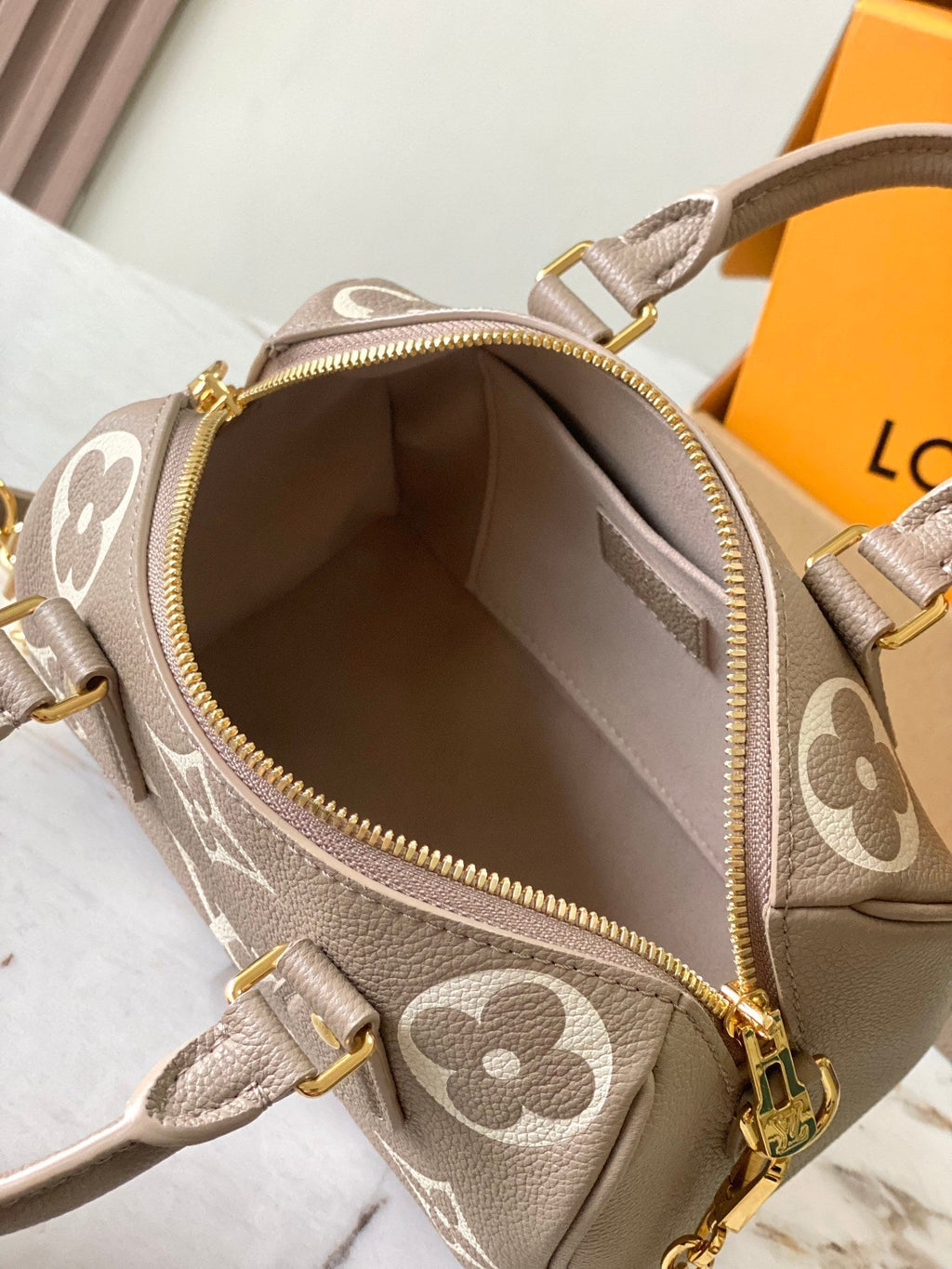 LOUIS VUITTON SPEEDY BANDOULIÈRE 20 IN TAUPE BROWN AND WHITE MONOGRAM EMPREINTE LEATHER