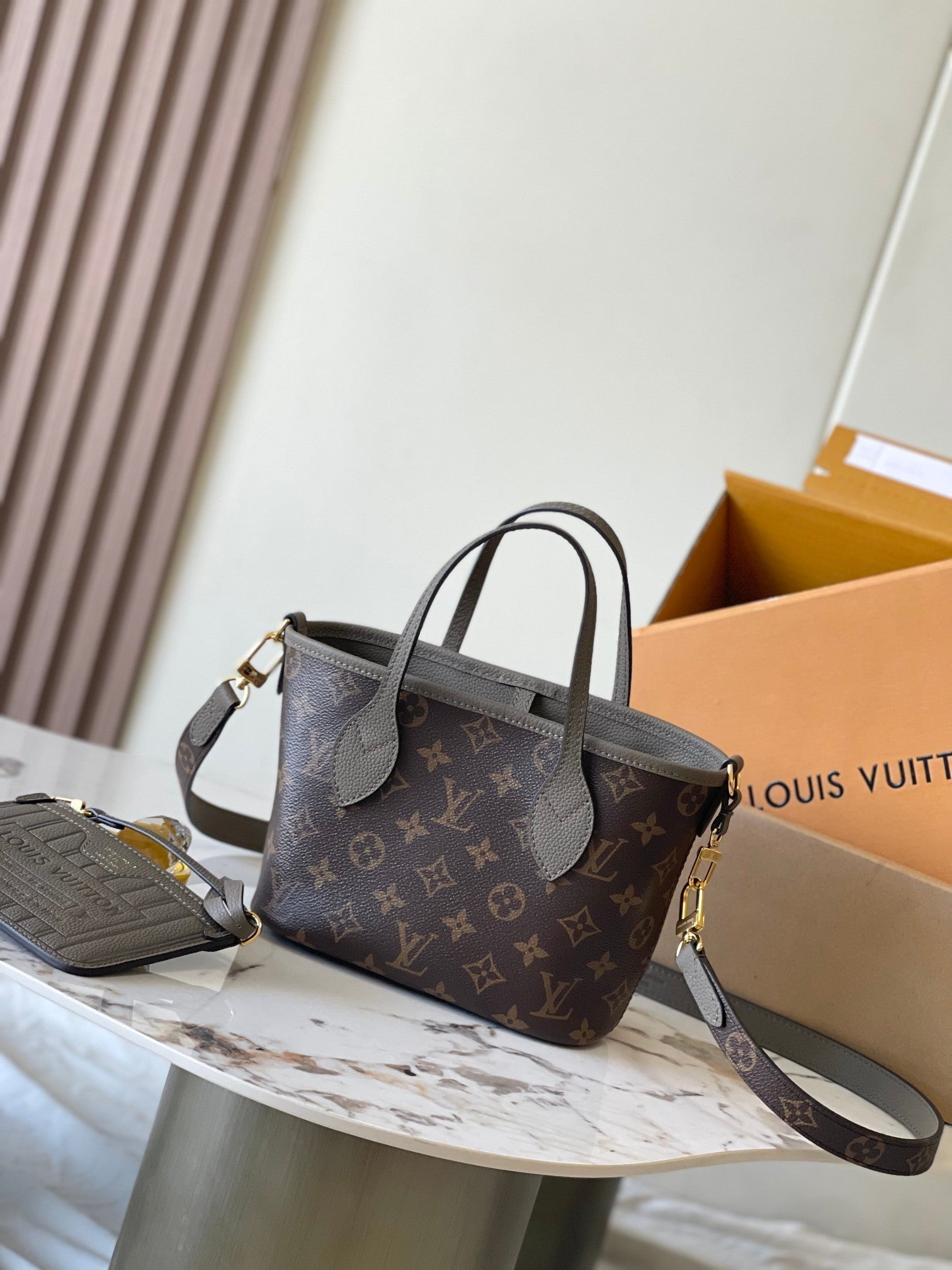 LOUIS VUITTON NEVERFULL BANDOULIÈRE INSIDE OUT BB 24 IN BROWN MONOGRAM CANVAS AND GRAY CALFSKIN