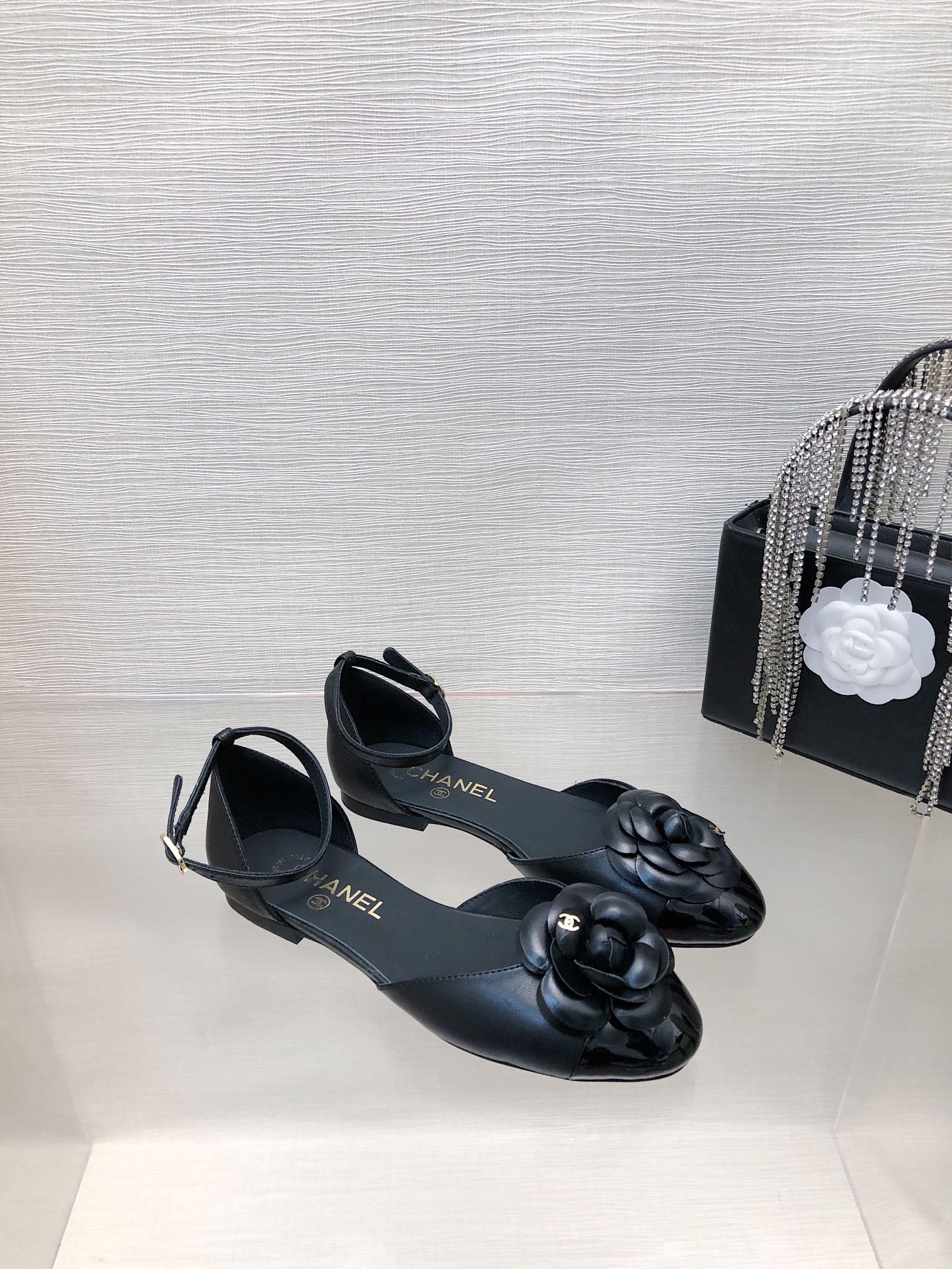 CHANEL BLACK LAMBSKIN CAMELLIA HOLLOW SANDAL