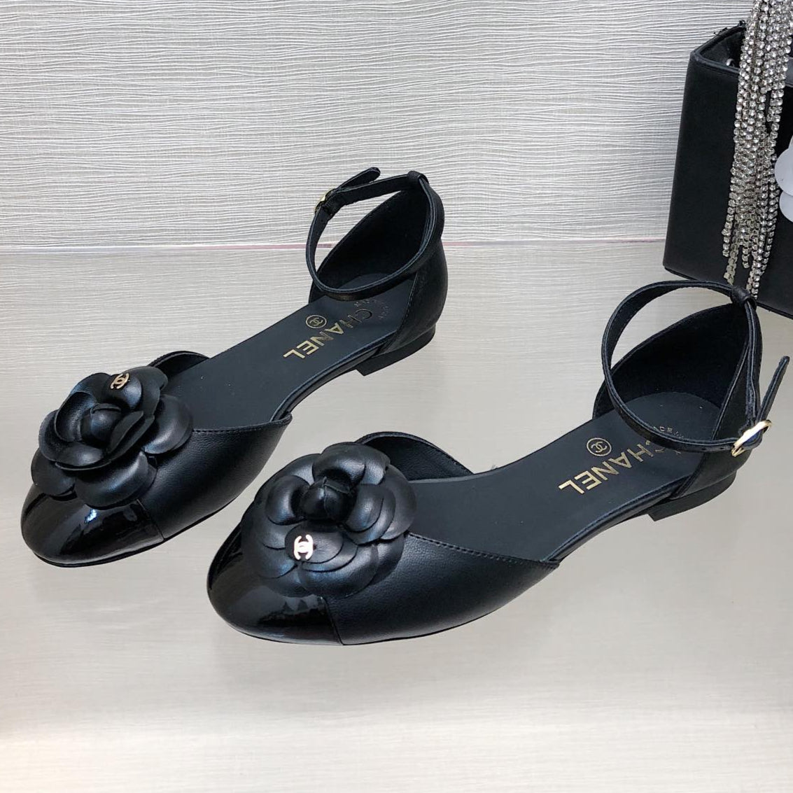 CHANEL BLACK LAMBSKIN CAMELLIA HOLLOW SANDAL