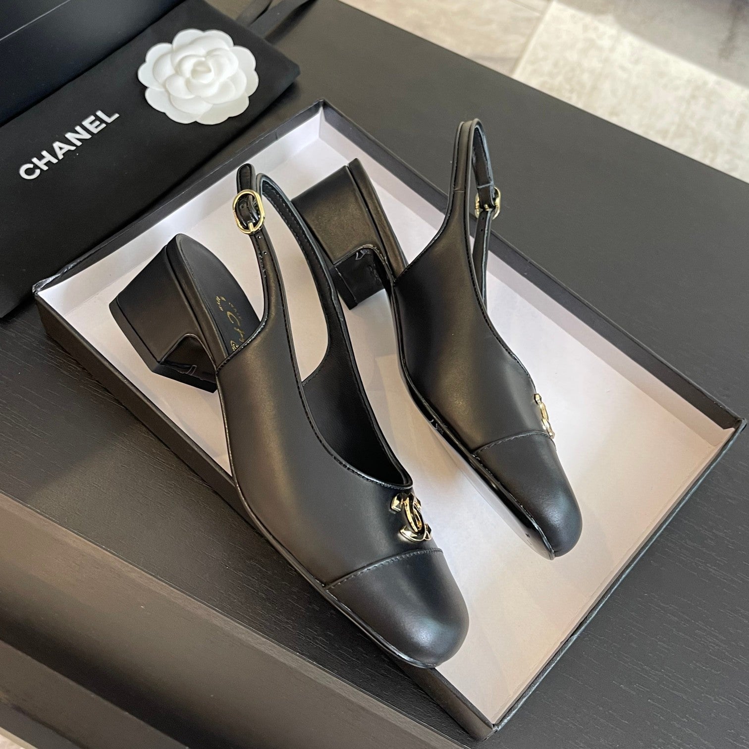 CHANEL SLINGBACKS IN BLACK CALFSKIN