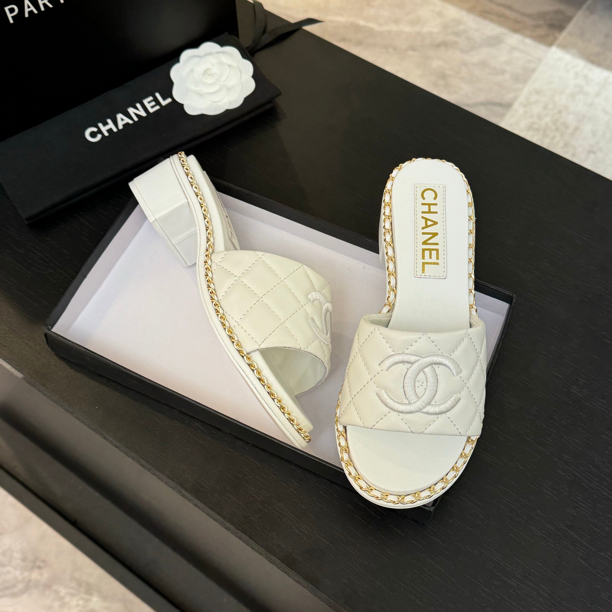 CHANEL HIGH FLATFORM SLIPPER IN WHITE EMBOSSED SHEEPSKIN