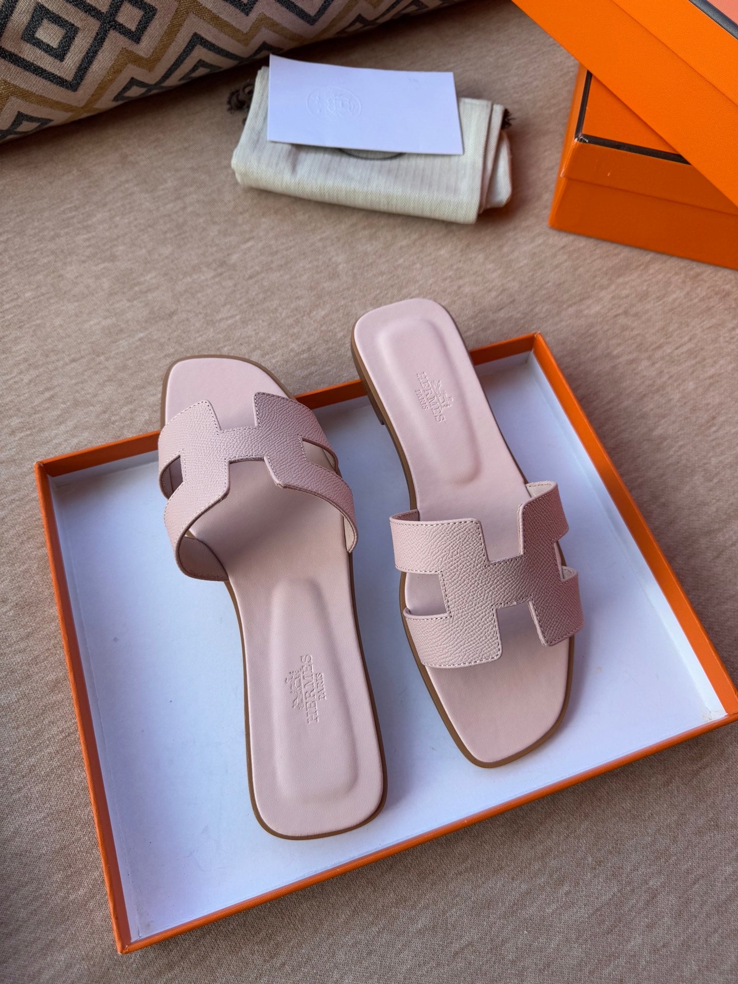 HERMES 0RAN SANDALS IN PASTEL PINK CALFSKIN