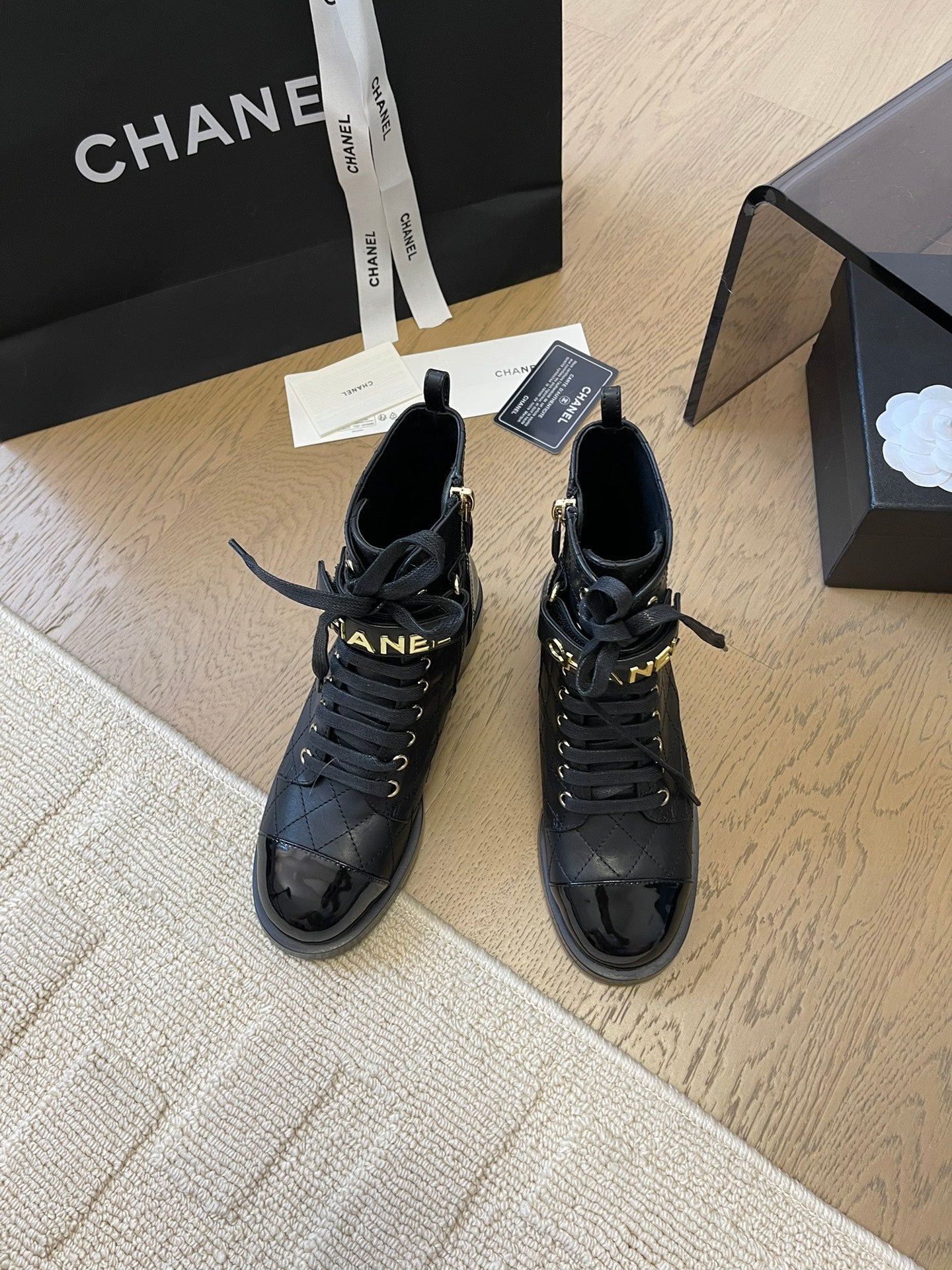 CHANEL ALPHABET MARTIN BOOTS IN BLACK LAMBSKIN