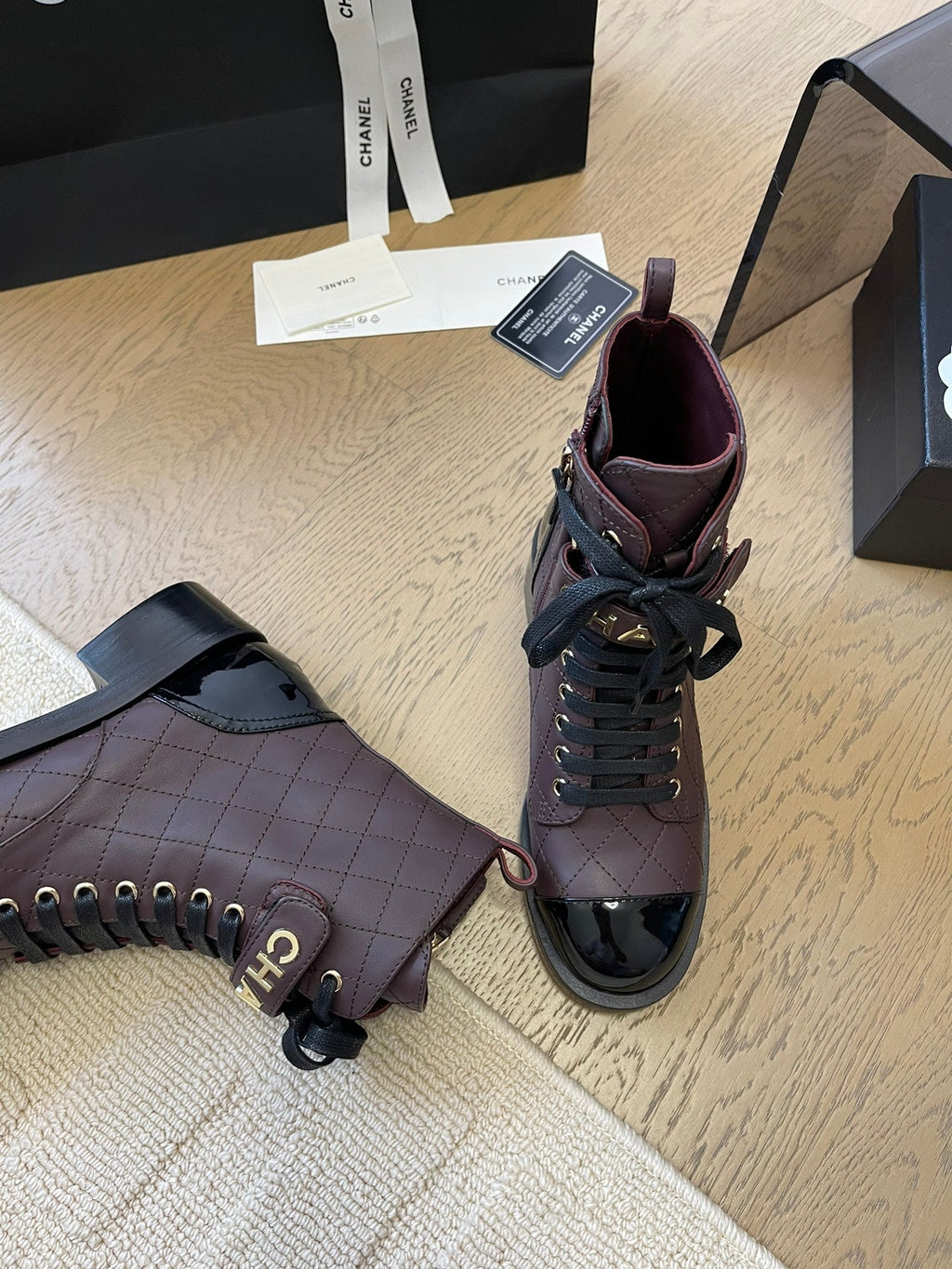 CHANEL ALPHABET MARTIN BOOTS IN BRUNETTE BROWN MIX BLACK LAMBSKIN