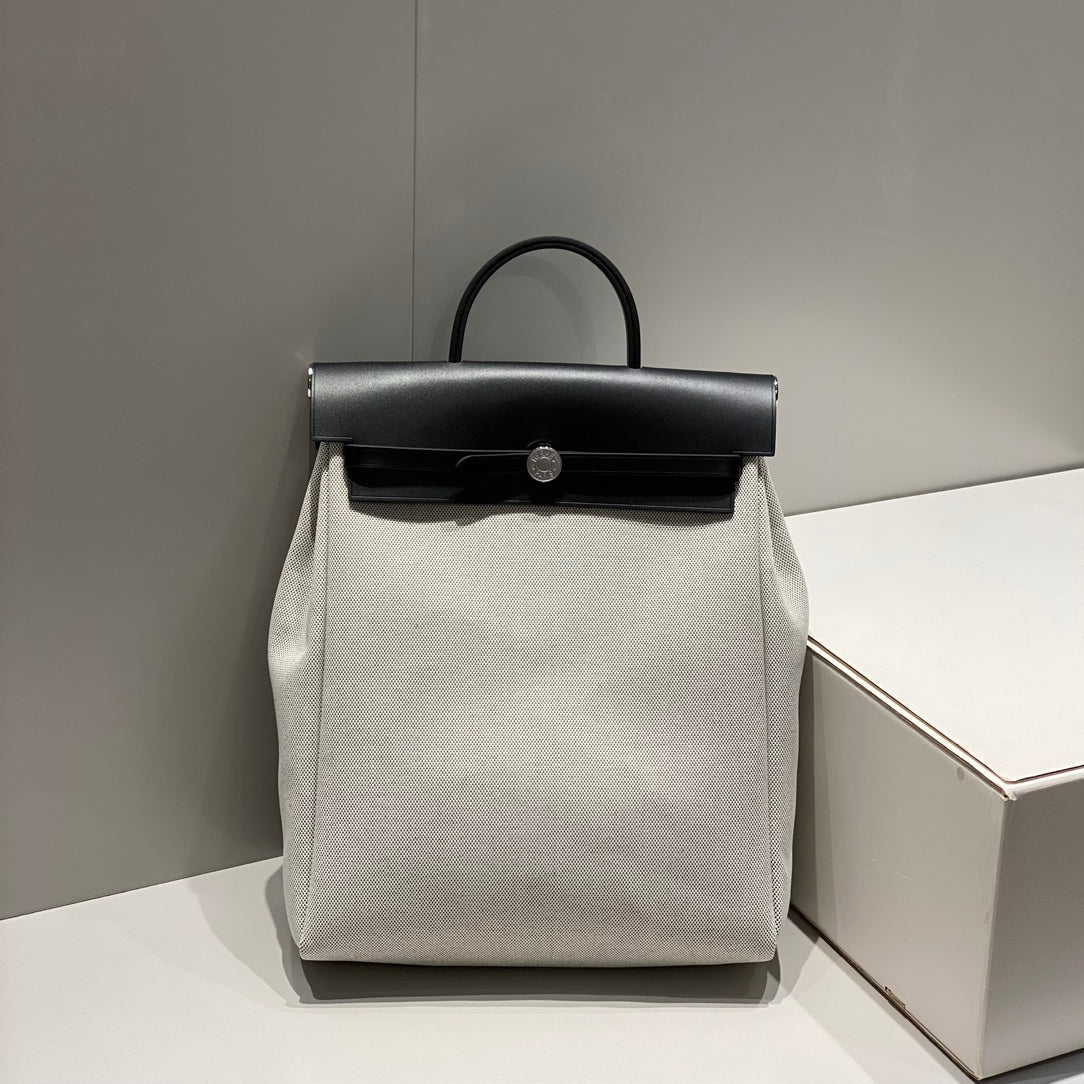 HERMES HERBAG A DOS ZIP RETOURNE BACKPACK 29 IN OFF-WHITE CANVAS AND BLACK CALFSKIN