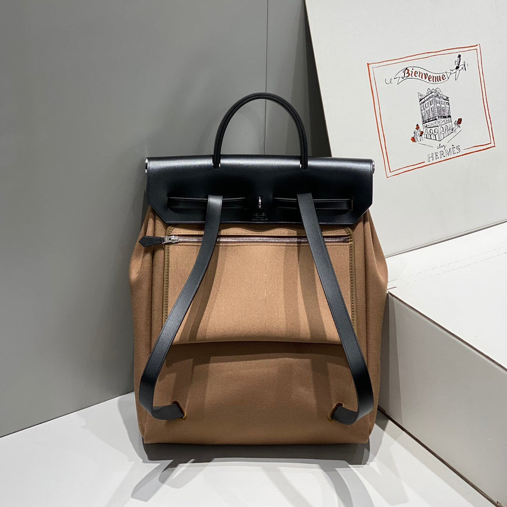 HERMES HERBAG A DOS ZIP RETOURNE BACKPACK 29 IN BROWN CANVAS AND BLACK CALFSKIN