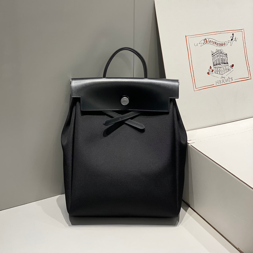 HERMES HERBAG A DOS ZIP RETOURNE BACKPACK 29 IN BLACK CANVAS AND CALFSKIN