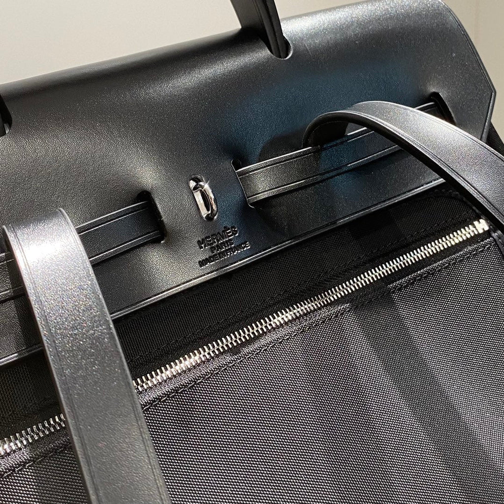 HERMES HERBAG A DOS ZIP RETOURNE BACKPACK 29 IN BLACK CANVAS AND CALFSKIN