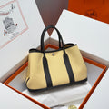 HERMES GARDEN PARTY 30CM IN DARK BEIGE TOILETS COTTON CANVAS AND BLACK CALFSKIN
