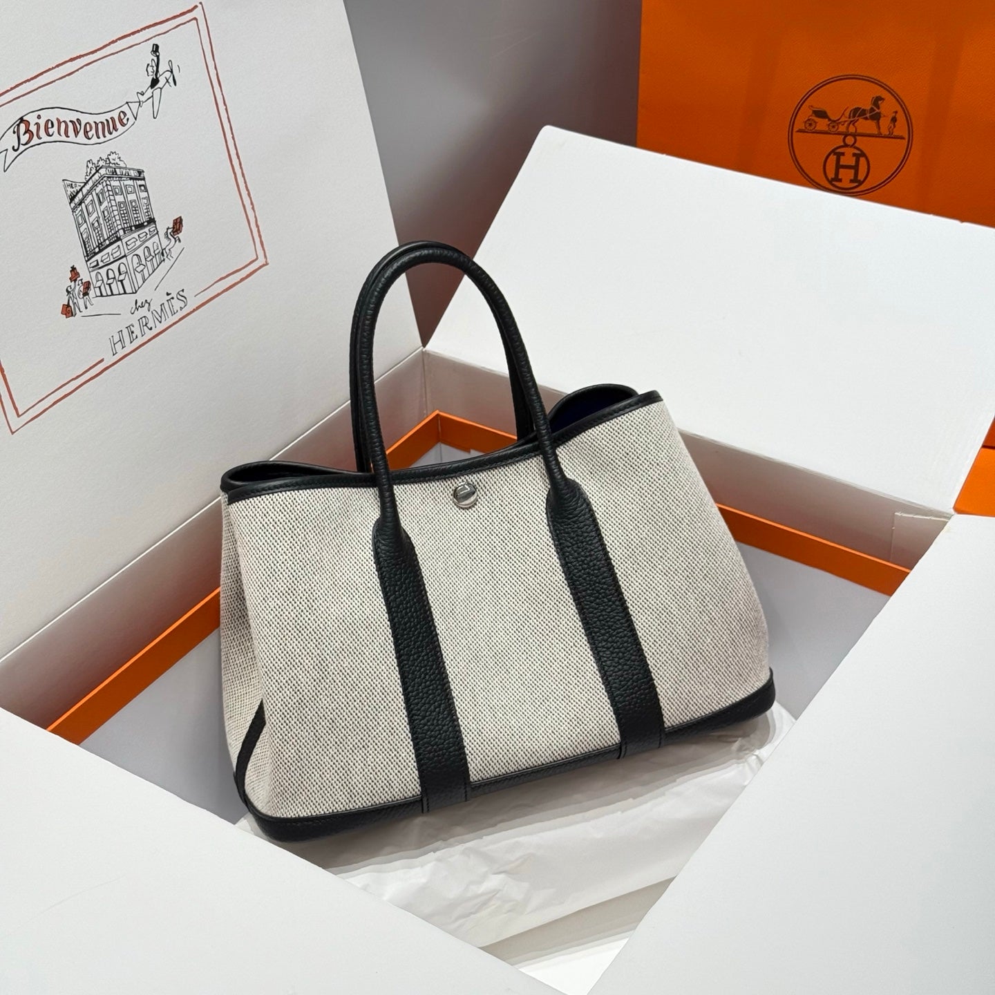 HERMES GARDEN PARTY 30CM IN WHITE TOILETS COTTON CANVAS AND BLACK CALFSKIN BLUE CANVAS ON SIDE OTHER