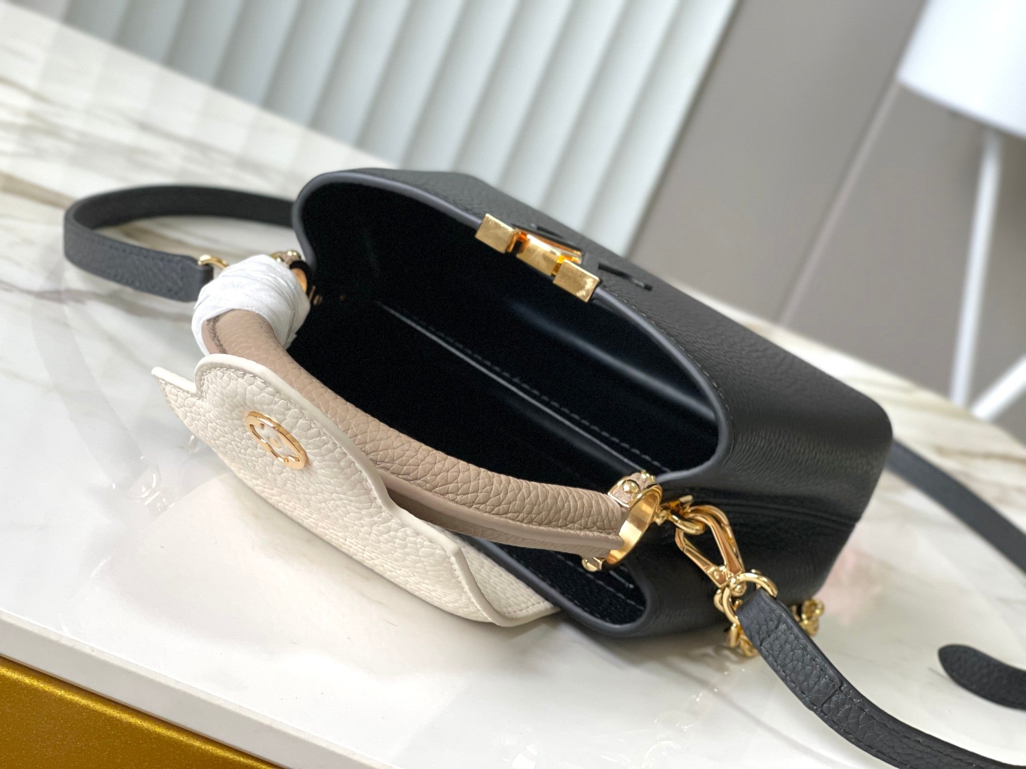 LOUIS VUITTON CAPUCINES MINI 21 IN BLACK MIX WHITE TAURILLON GOLD HARDWARE