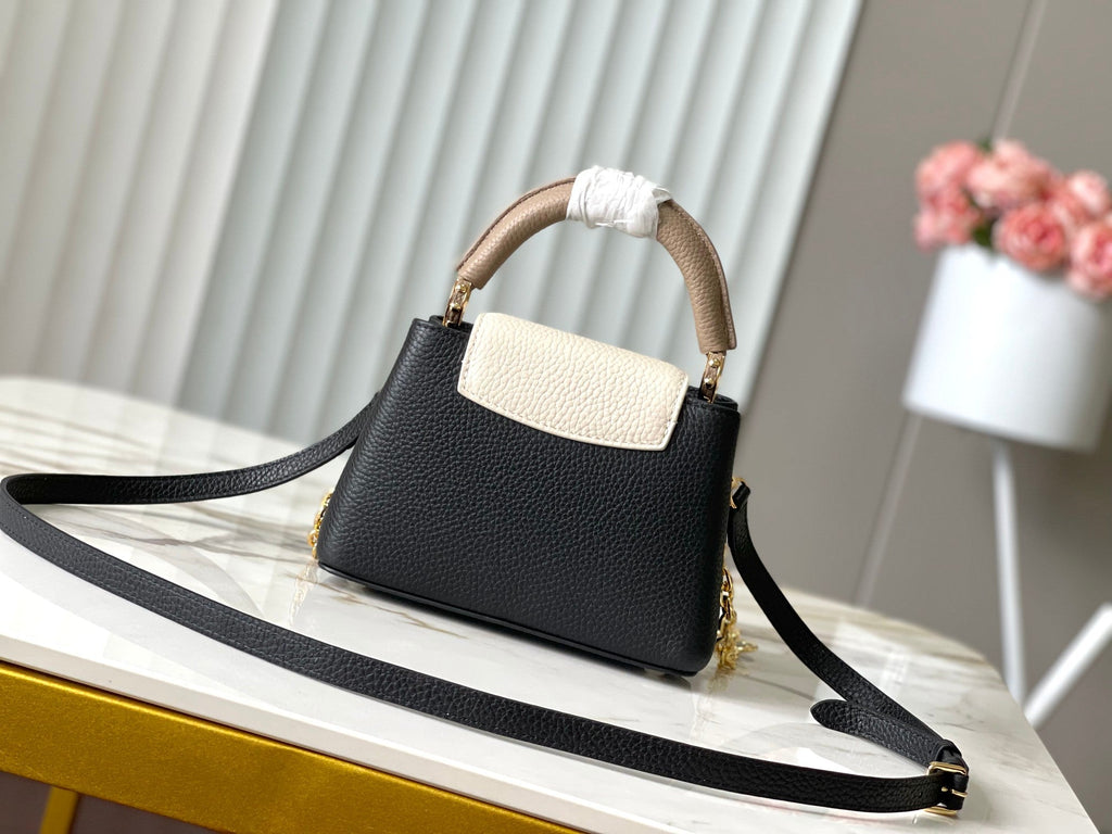 LOUIS VUITTON CAPUCINES MINI 21 IN BLACK MIX WHITE TAURILLON GOLD HARDWARE