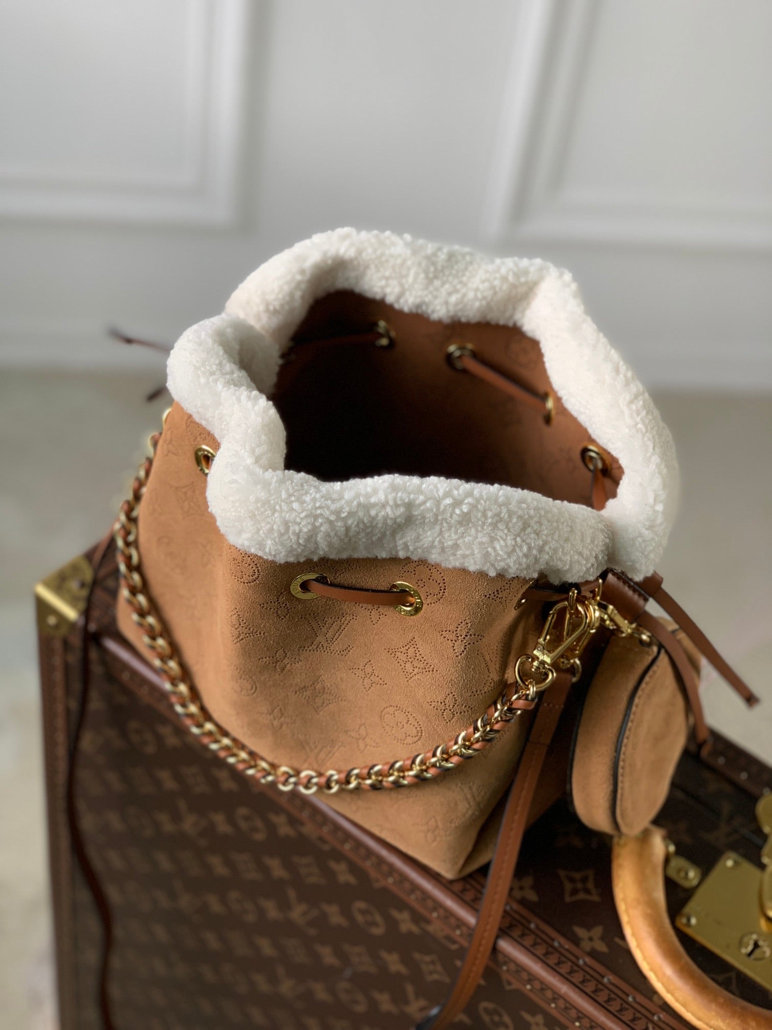 LOUIS VUITTON BELLA 22 IN CINNAMON BROWN MONOGRAM PERFORATED SUEDE AND WHITE SHEARLING TRIM