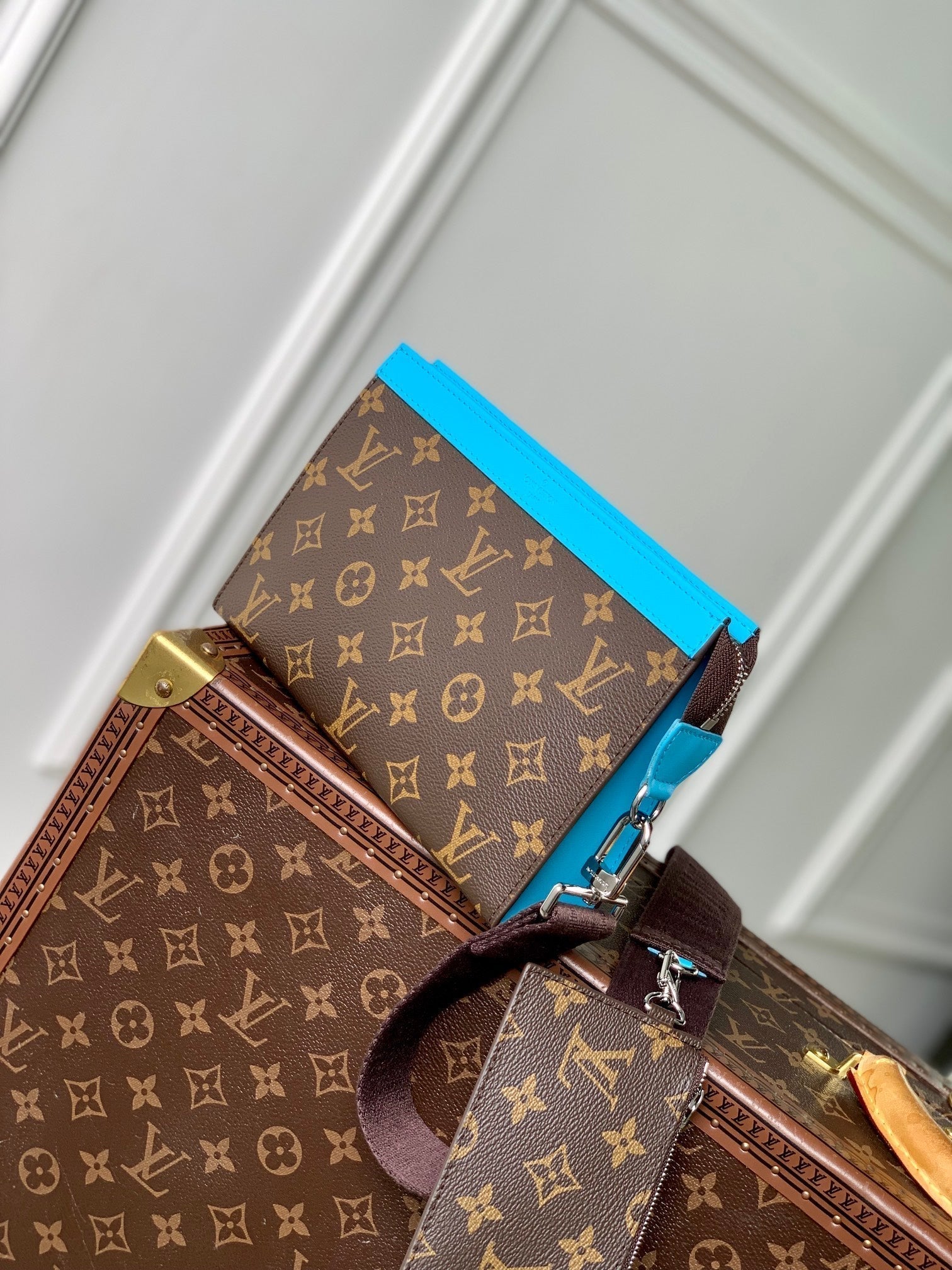LOUIS VUITTON GASTON WEARABLE WALLET 18 IN BROWN MONOGRAM CANVAS MIX SKY CALFSKIN