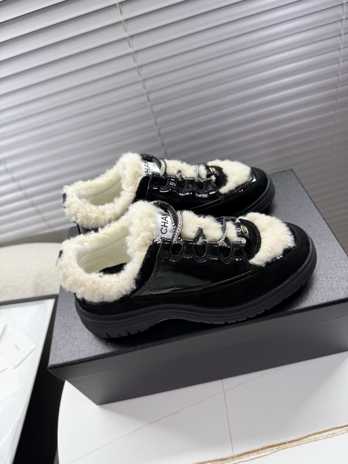CHANEL 25S SNEAKERS WITH FUR AENTS 35MM IN BLACK CALFSKIN