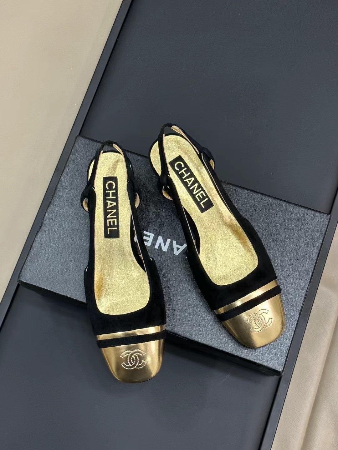 CHANEL SLINGBACKS IN BLACK SUEDE AND GOLDEN LAMBSKIN