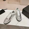 CHANEL SNEAKERS IN GLOSSY SILVER LAMBSKIN