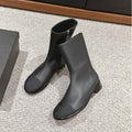 CHANEL SHORT BOOTS IN BLACK LAMBSKIN AND FABRIC