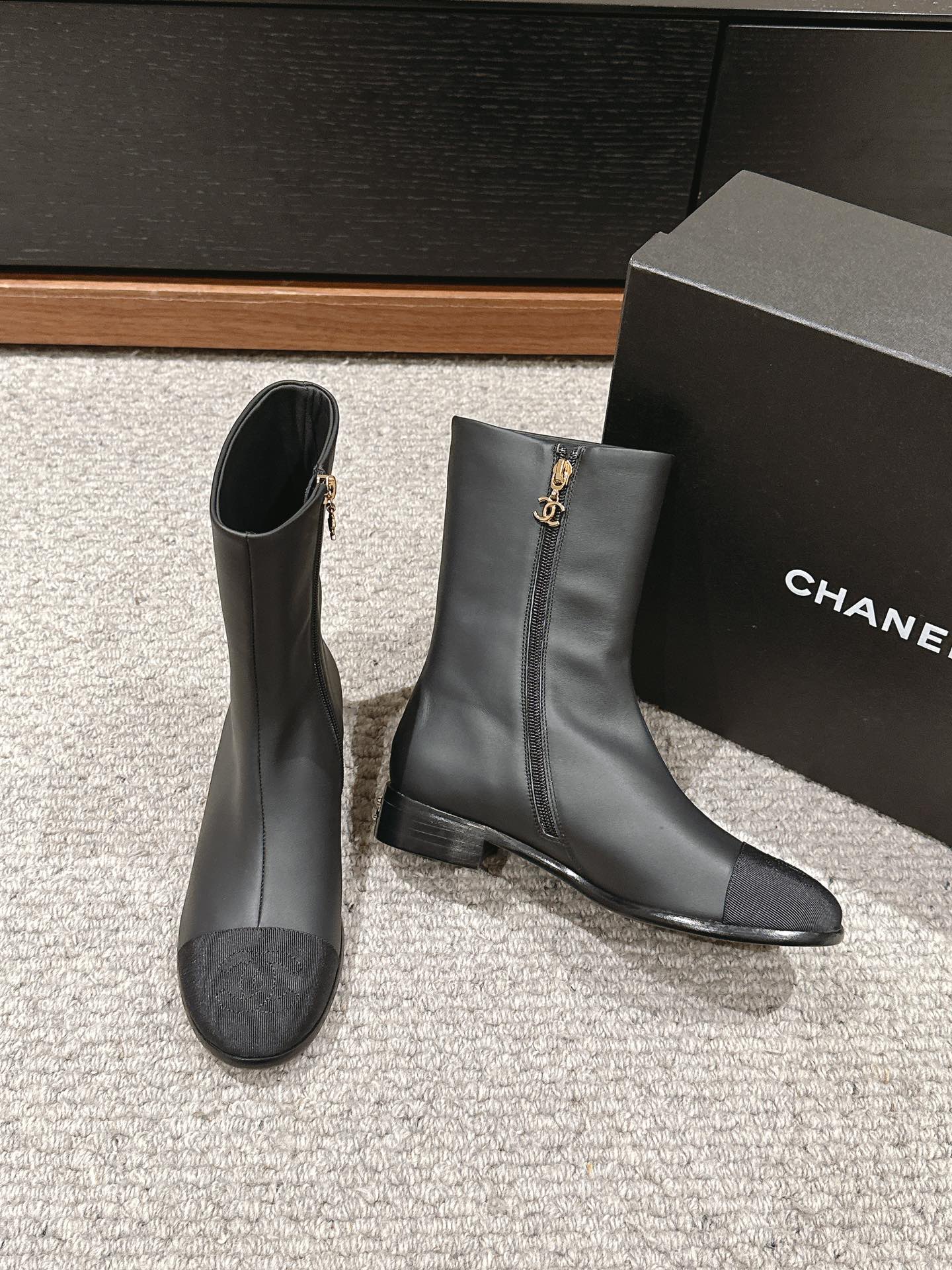 CHANEL SHORT BOOTS IN BLACK LAMBSKIN AND FABRIC