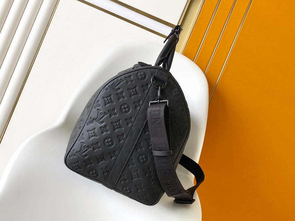 LOUIS VUITTON LV 25S KEEPALL BANDOULIÈRE BAG 50 IN BLACK EMBOSSED TAURILLON CALFSKIN MONOGRAM