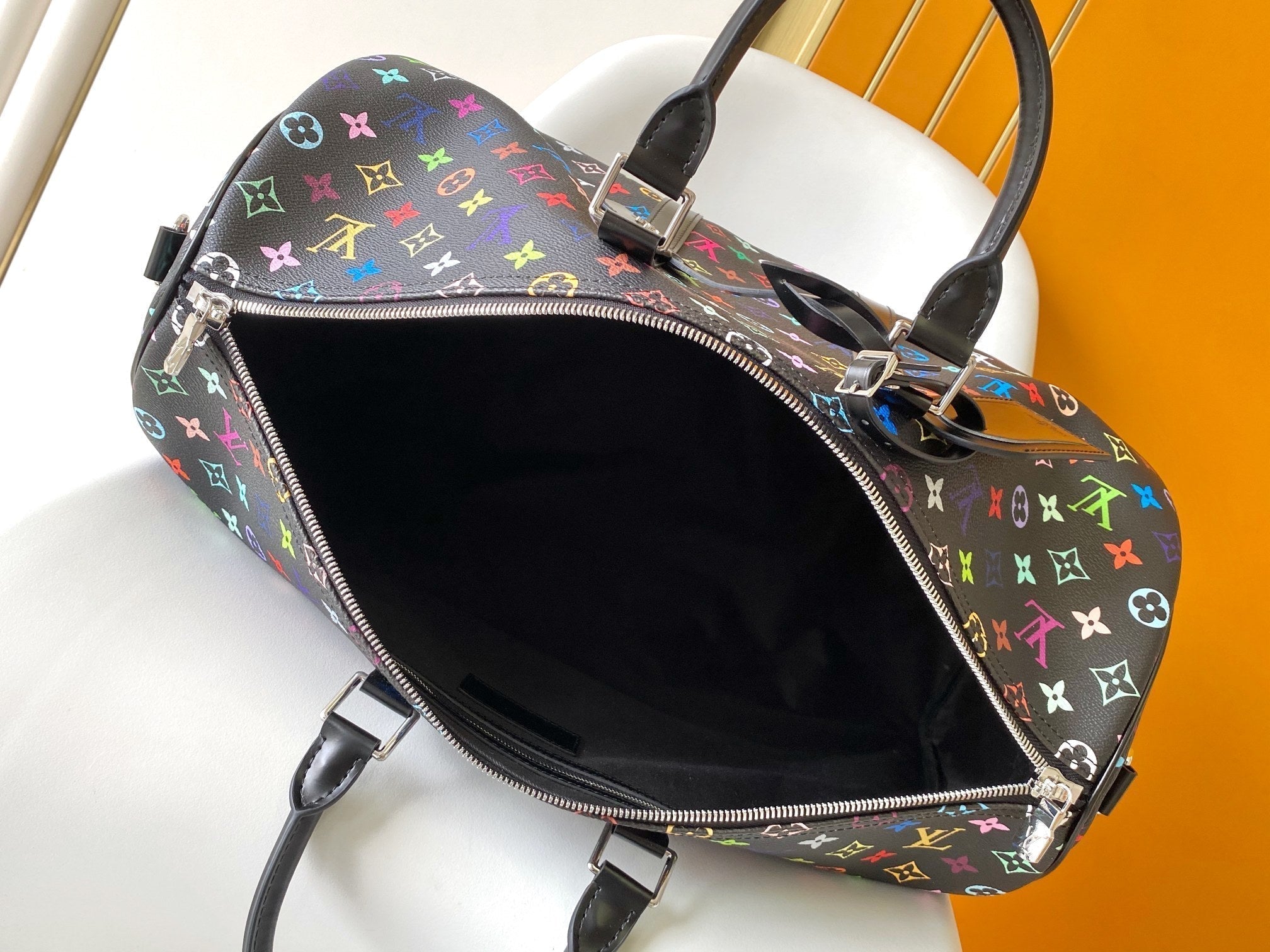 LOUIS VUITTON KEEPALL BANDOULIÈRE 50 BAG IN MULTICOLORED MONOGRAM COATED CANVAS