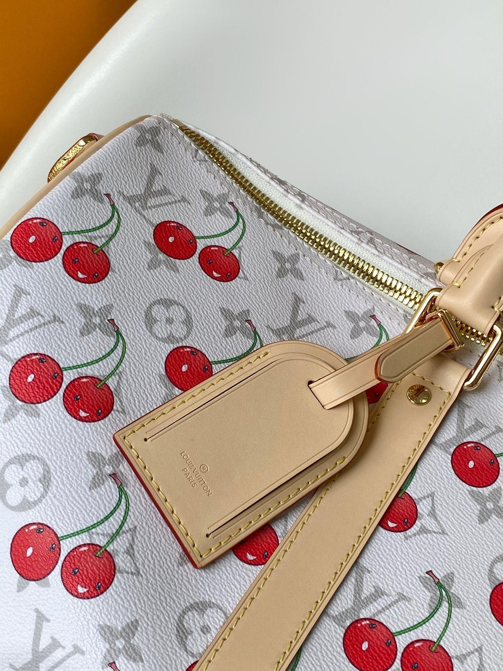 LOUIS VUITTON KEEPALL BANDOULIÈRE 45 IN WHITE AND RED CALFSKIN